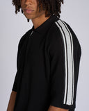 POLO IN MAGLIA CON BANDE SMACCHINATE