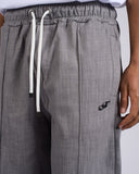 PANTALONE EFFETTO DENIM CON LOGO METALLICO