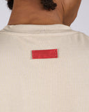 T-SHIRT IN COTONE CON RICAMO ROSA E ETICHETTA CON LOGO