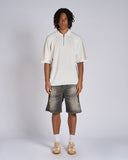 POLO IN MAGLIA CON BANDE SMACCHINATE