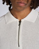 POLO IN MAGLIA CON BANDE SMACCHINATE