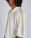 POLO IN MAGLIA CON BANDE SMACCHINATE