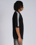 POLO IN MAGLIA CON BANDE SMACCHINATE